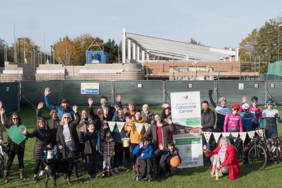 Fundraisers stand outside the new site
