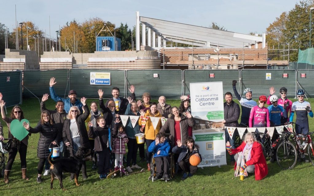 Fundraisers stand outside the new site 